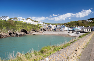 Benefits of Owning a Campervan | Coastal bay with blue water. 