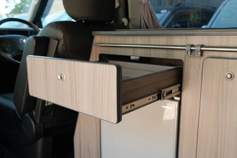campervan cooking | integrated drawers with lock buttons for storage