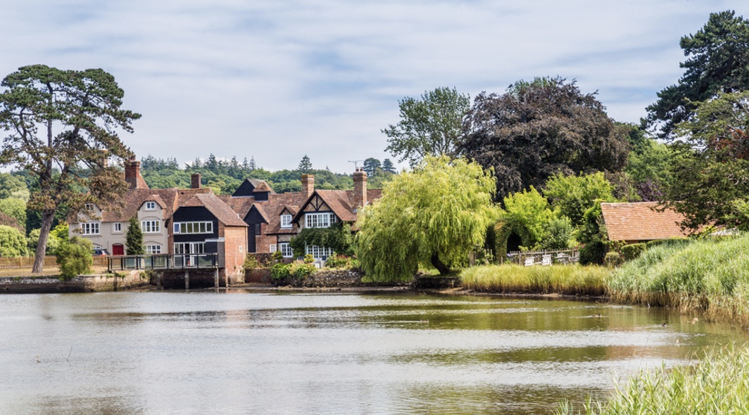 New year trip ideas | Village in the new forest with a large lake. 