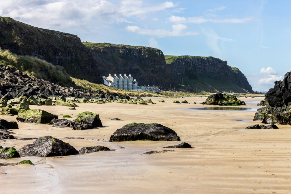 summer road trip | beach with large house in the distance