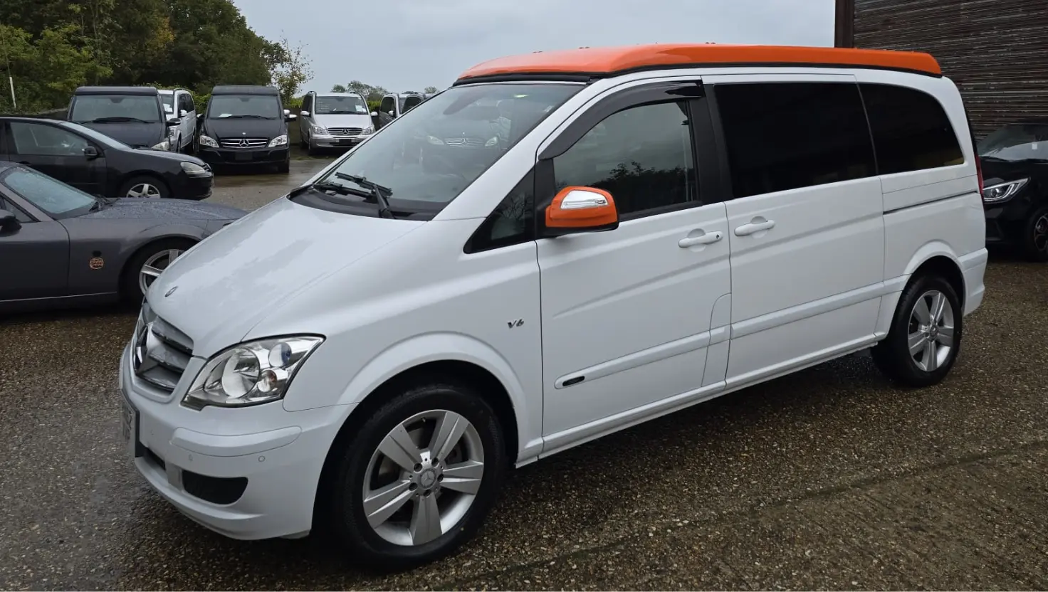 white campervan with an orange roof