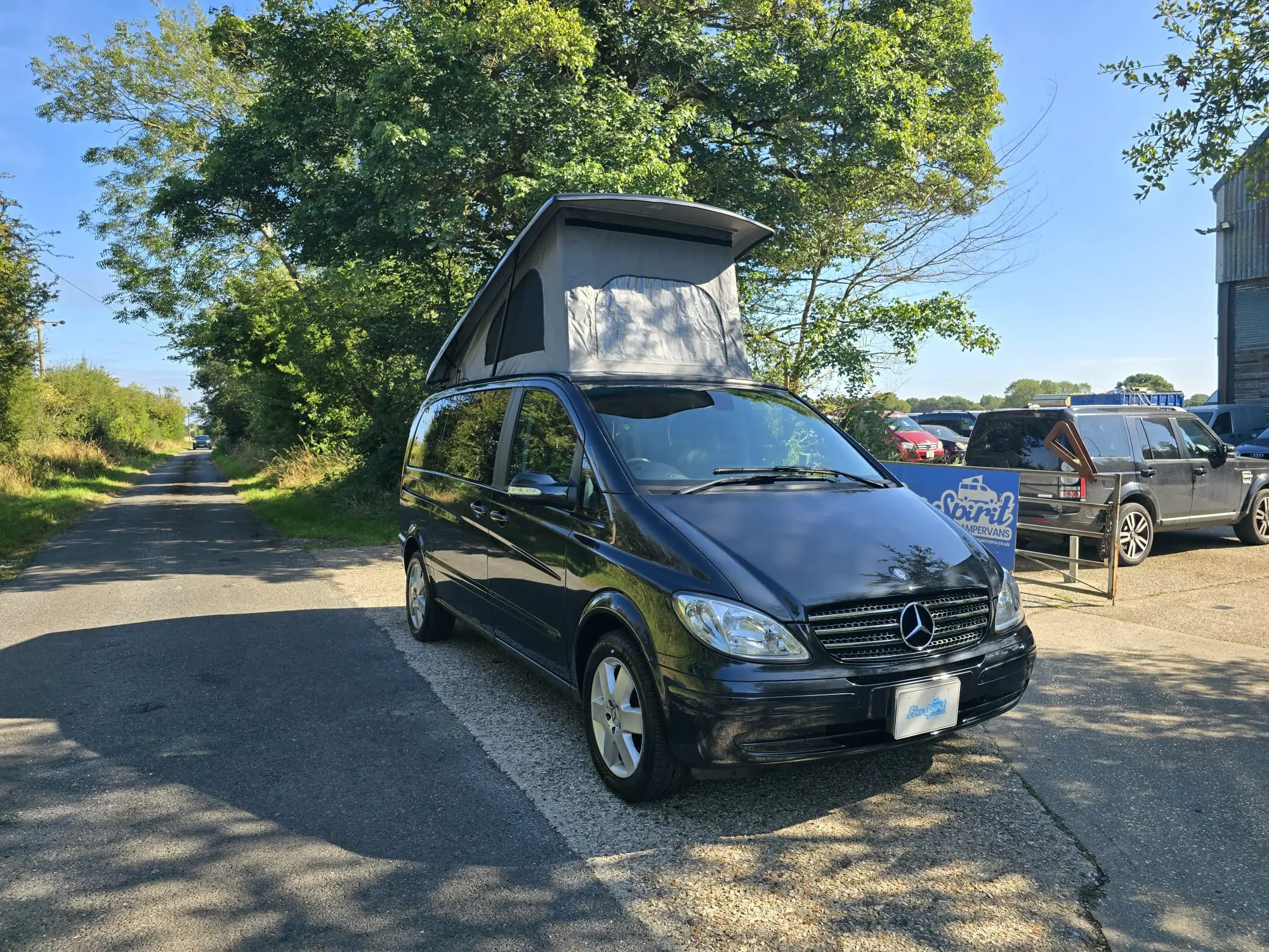Black mercedes viano campervan outside Free Spirit Campervans