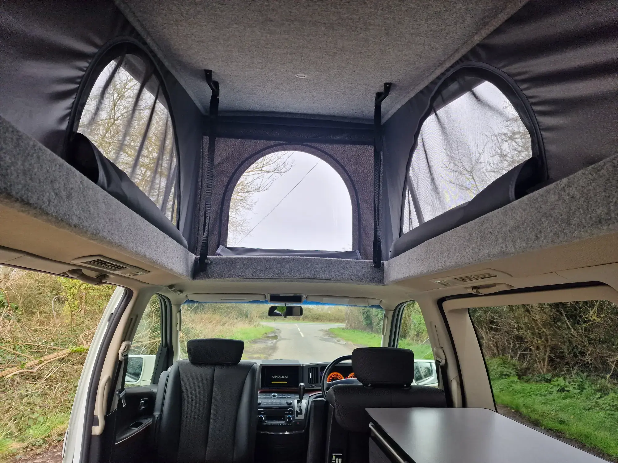 Inside a pop top roof free spirit campervan